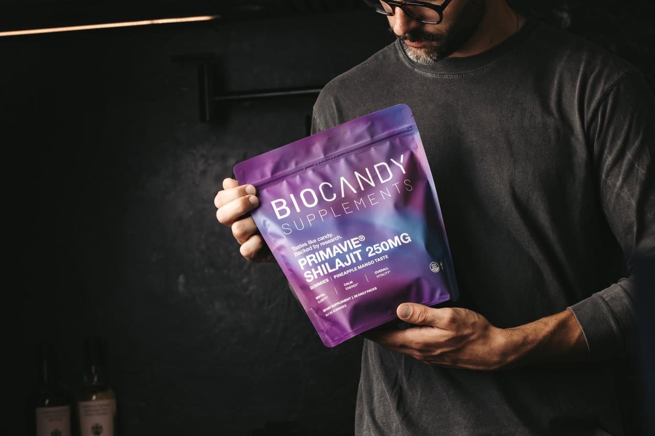 A person holding a BioCandy PrimaVie Shilajit pouch
